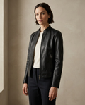 Woman wearing the black collarless zip jacket by Hale & Venn